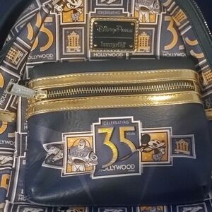 Disney Blue and Gold Backpack with Vintage Stamp Design